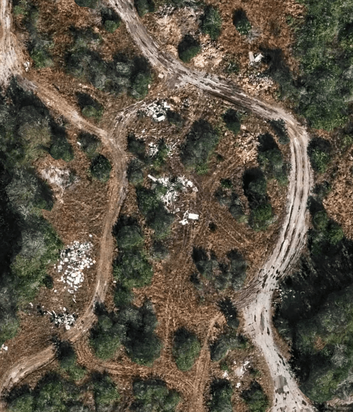 Aerial view of winding dirt tracks through scrubland